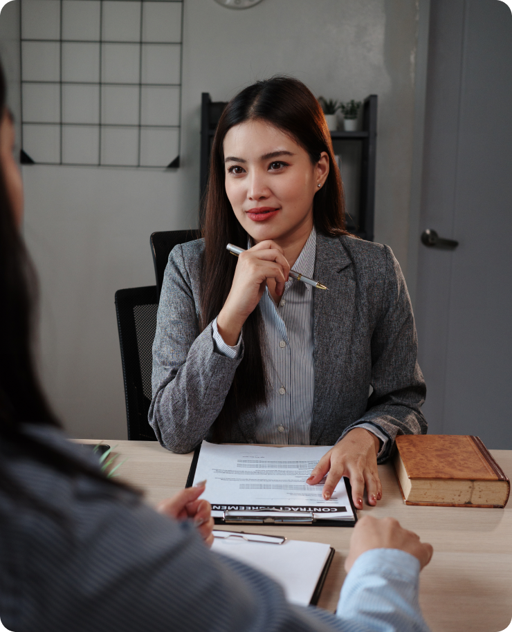Woman in a business suit at desk